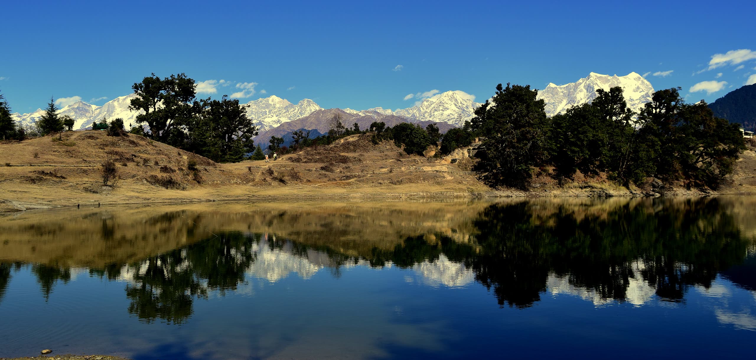 The snow ranges reflected in Deoria Tal at sunrise