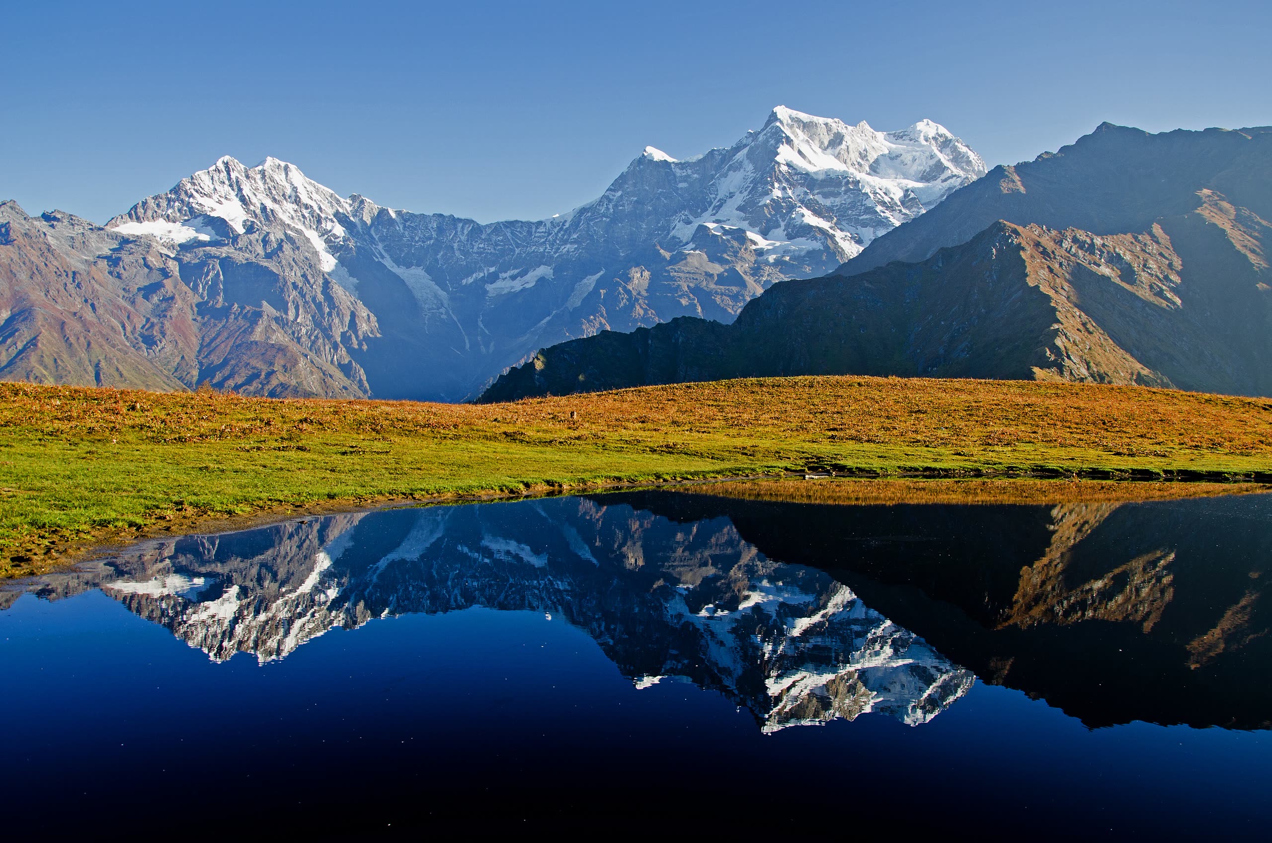 Chaukhamba mirrored in the pond at Buda Madhyamaheshwar