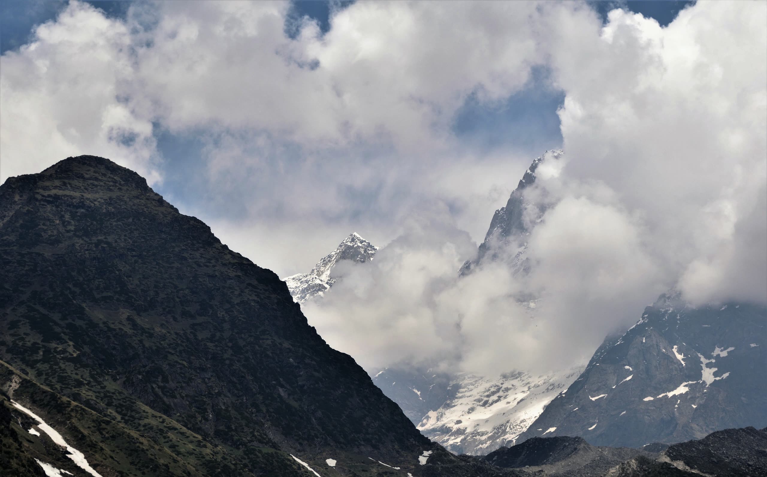 Storm clouds around Kedarnath peak above the temple valley
